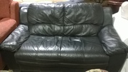 Black leather two seater sofa